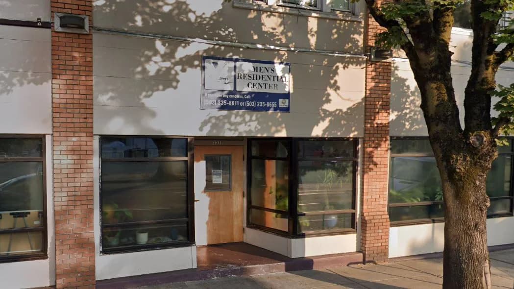 Front of Volunteers of America Oregon Men's Residential Center in Portland — exterior signage and entrance at the property where NWBreeze performed commercial duct and mini-split cleaning